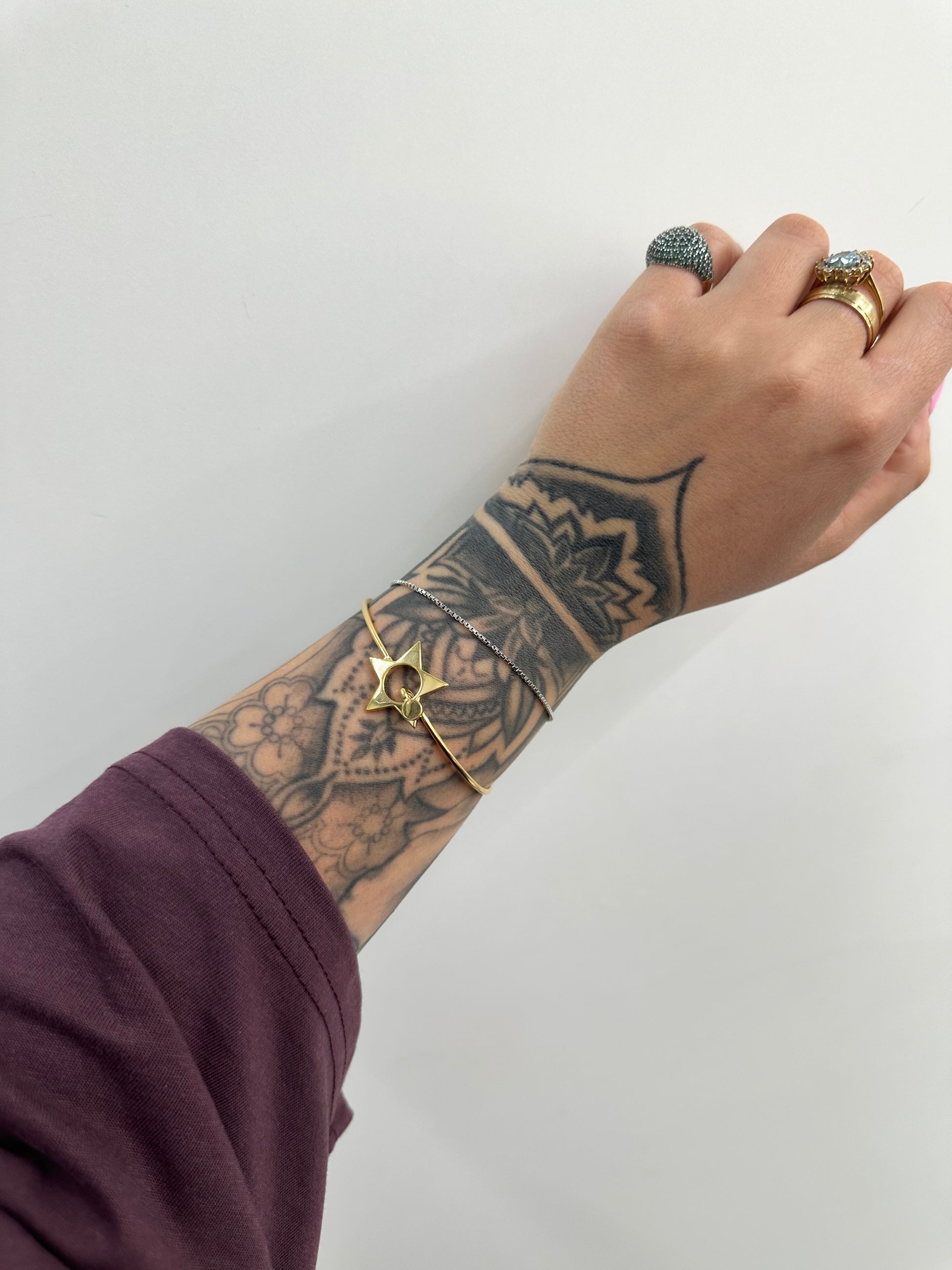 BRACCIALE RIGIDO CON STELLA ACCIAIO