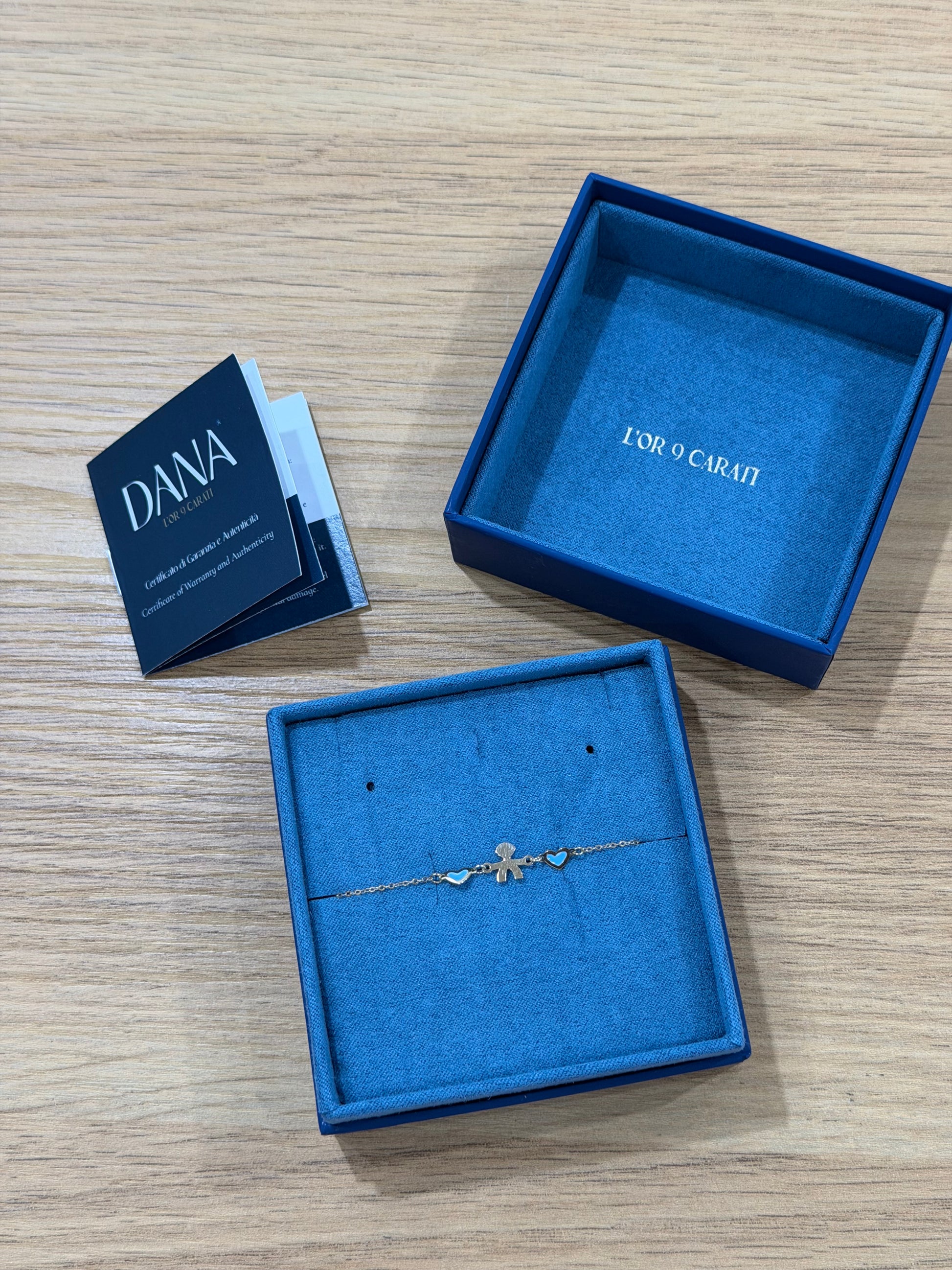 BRACCIALE CON BIMBO E CUORI ORO 9 CARATI DANA