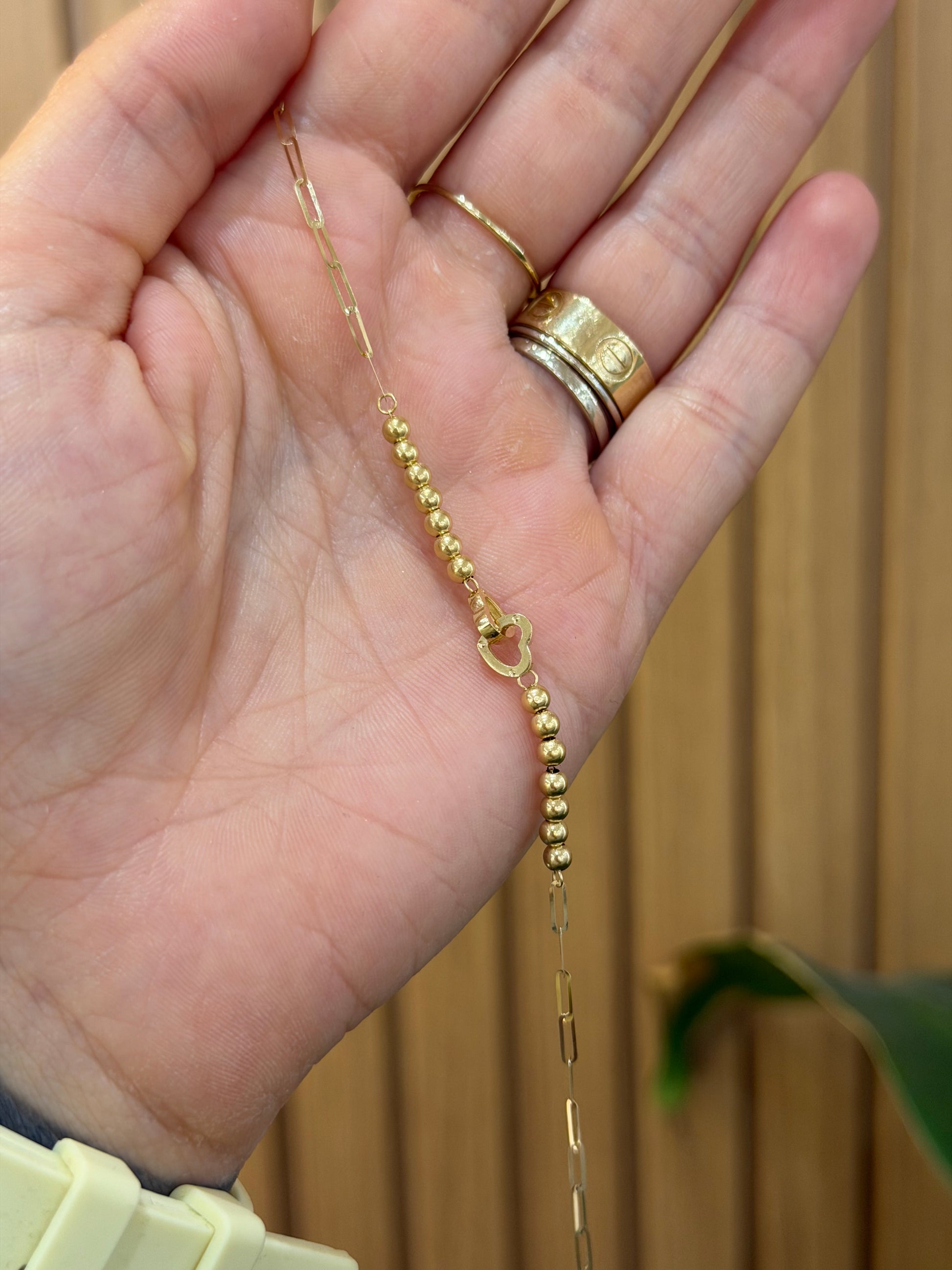 BRACCIALE ORO 18KT CUORI INTRECCIATI