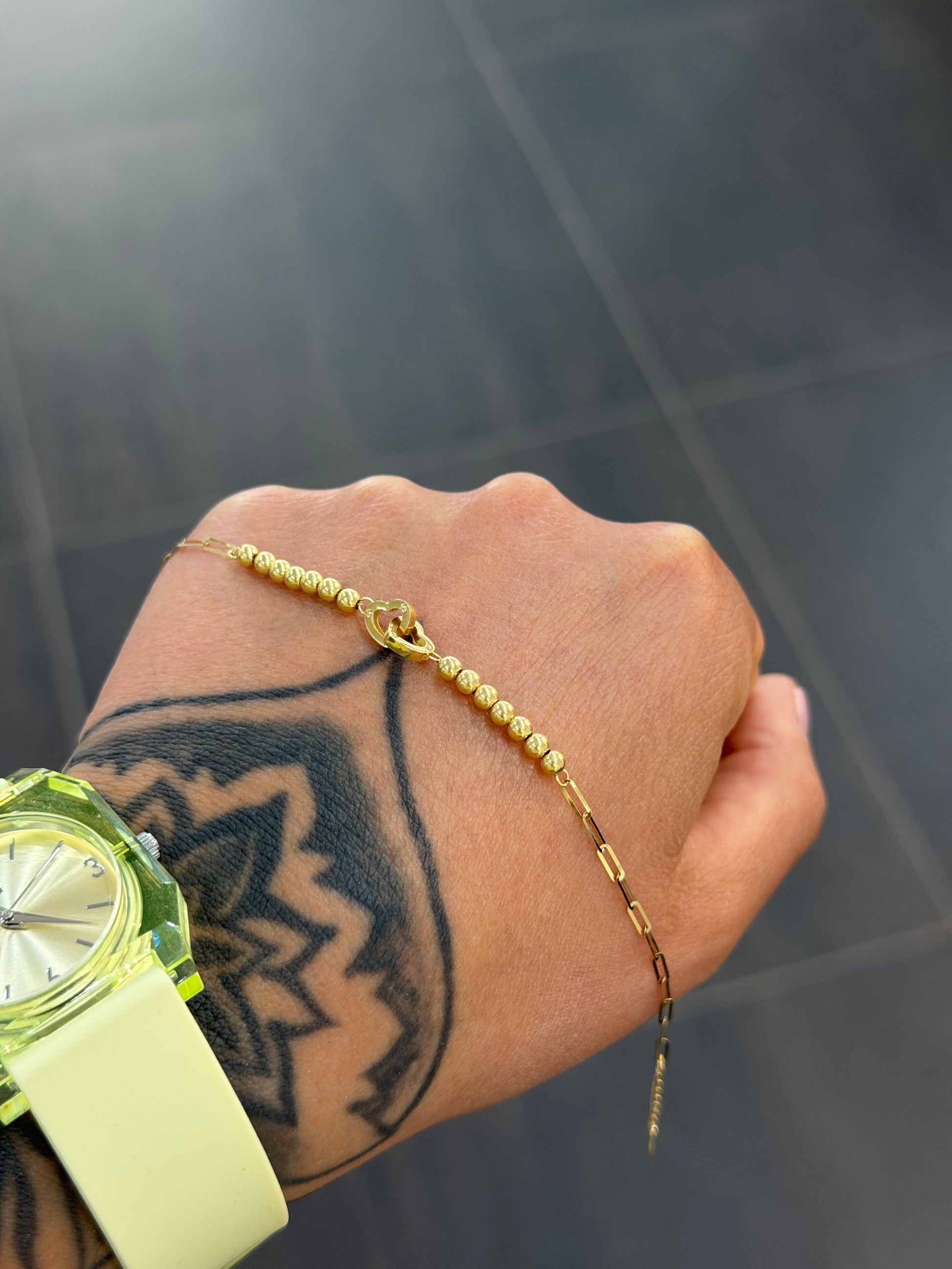 BRACCIALE ORO 18KT CUORI INTRECCIATI