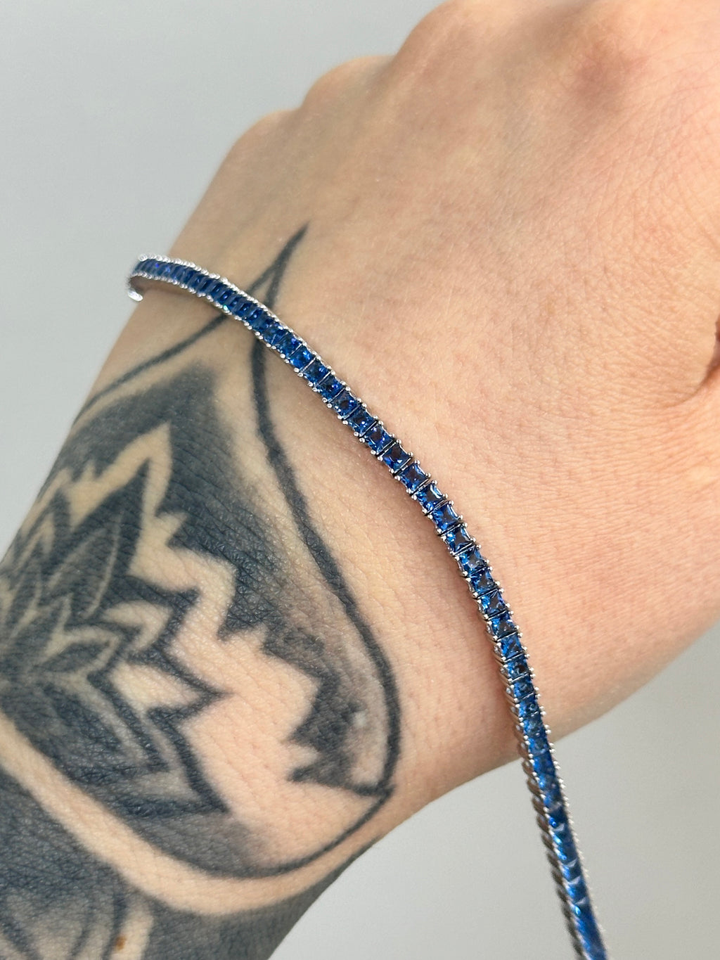 BRACCIALE TENNIS BLUE BAGUETTE ARGENTO