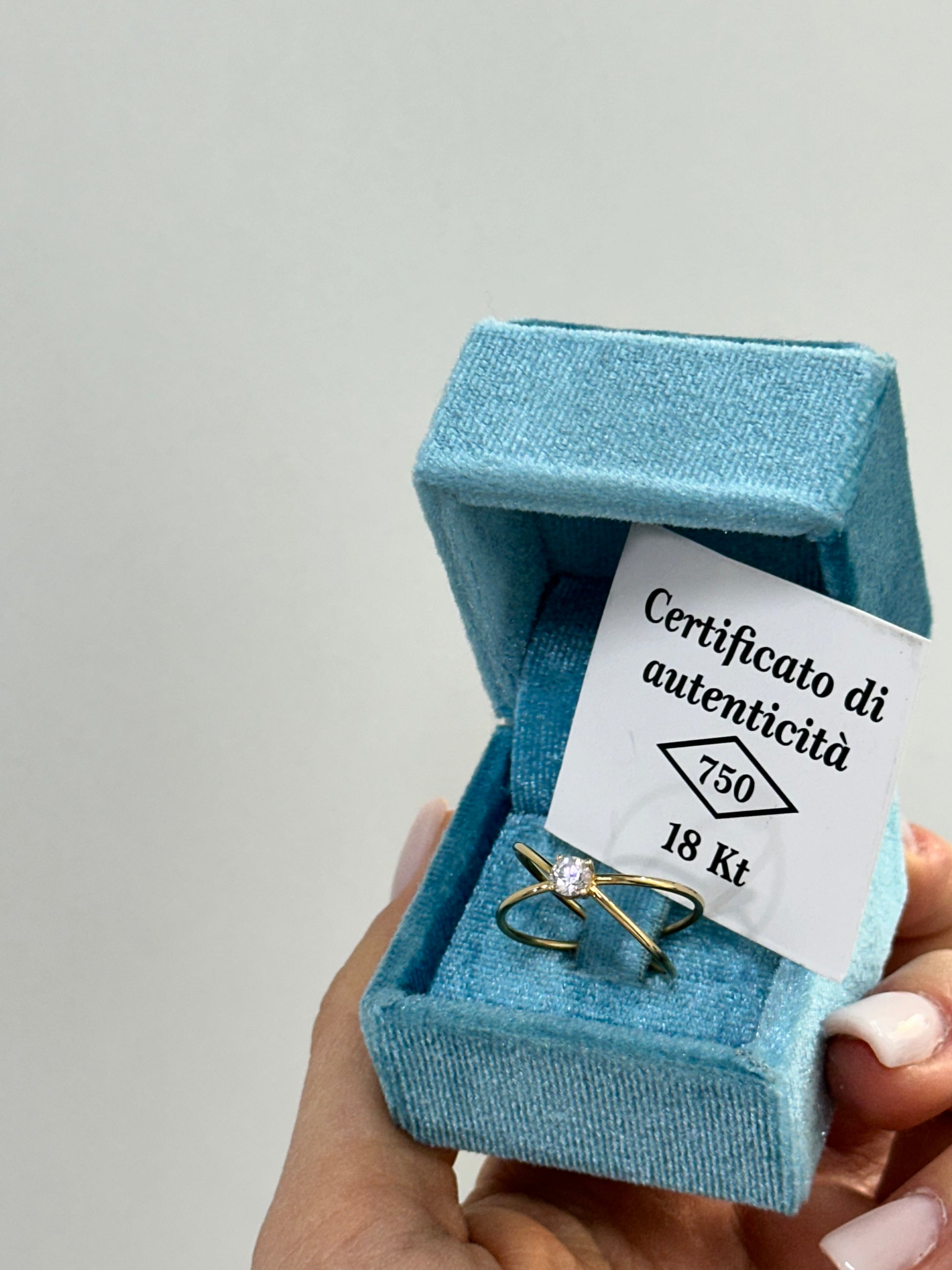 ANELLO INCROCIO CON ZIRCONE ORO 18KT