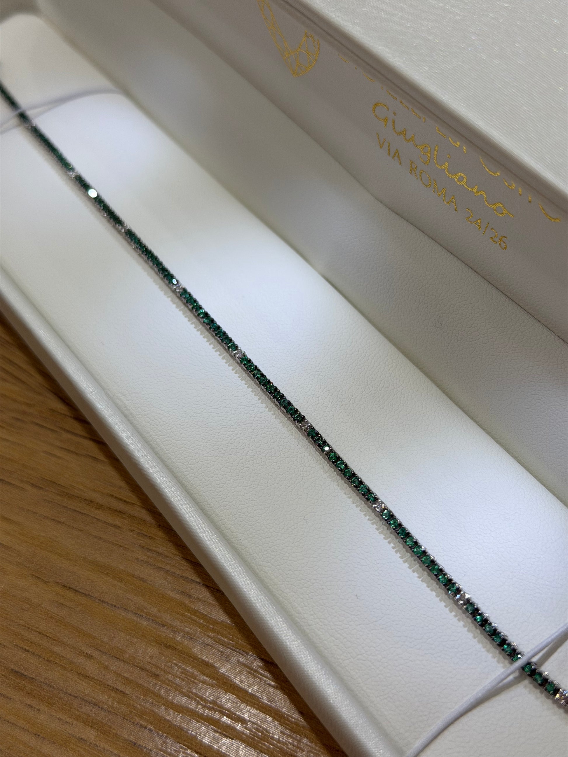 BRACCIALE TENNIS IN ORO 18KT DIAMANTI E SMERALDI