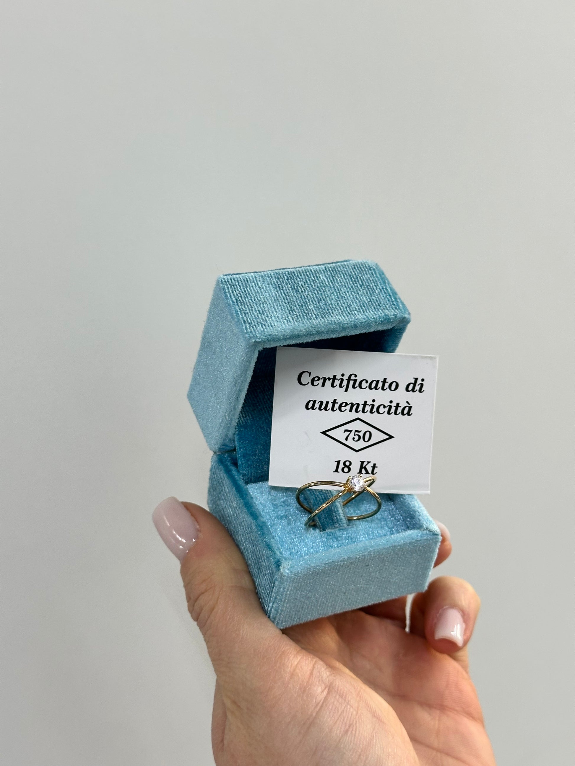 ANELLO INCROCIO CON ZIRCONE ORO 18KT