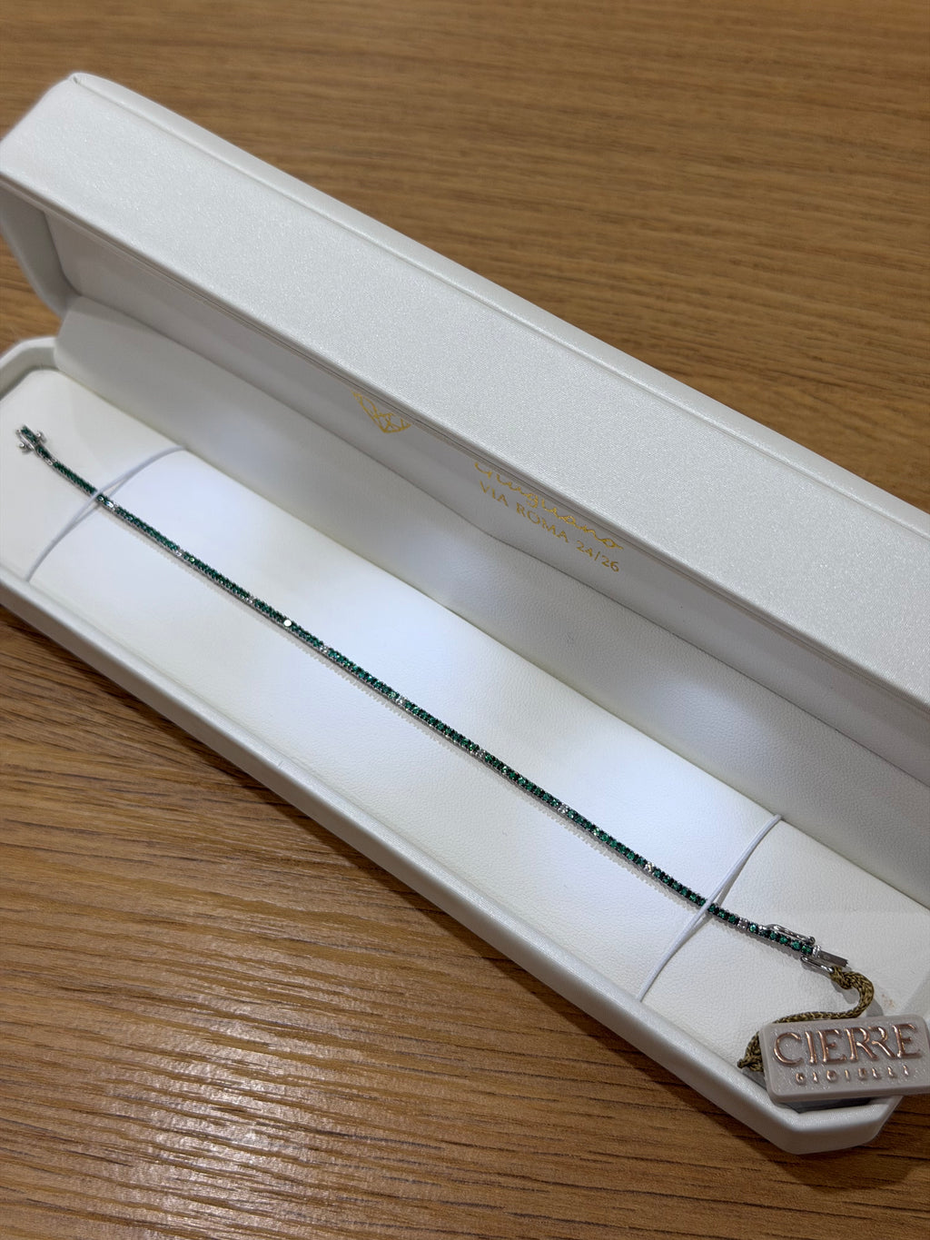 BRACCIALE TENNIS IN ORO 18KT DIAMANTI E SMERALDI