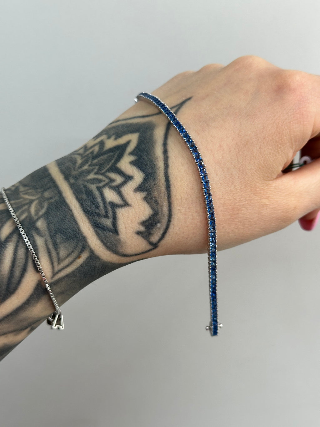BRACCIALE TENNIS BLUE BAGUETTE ARGENTO