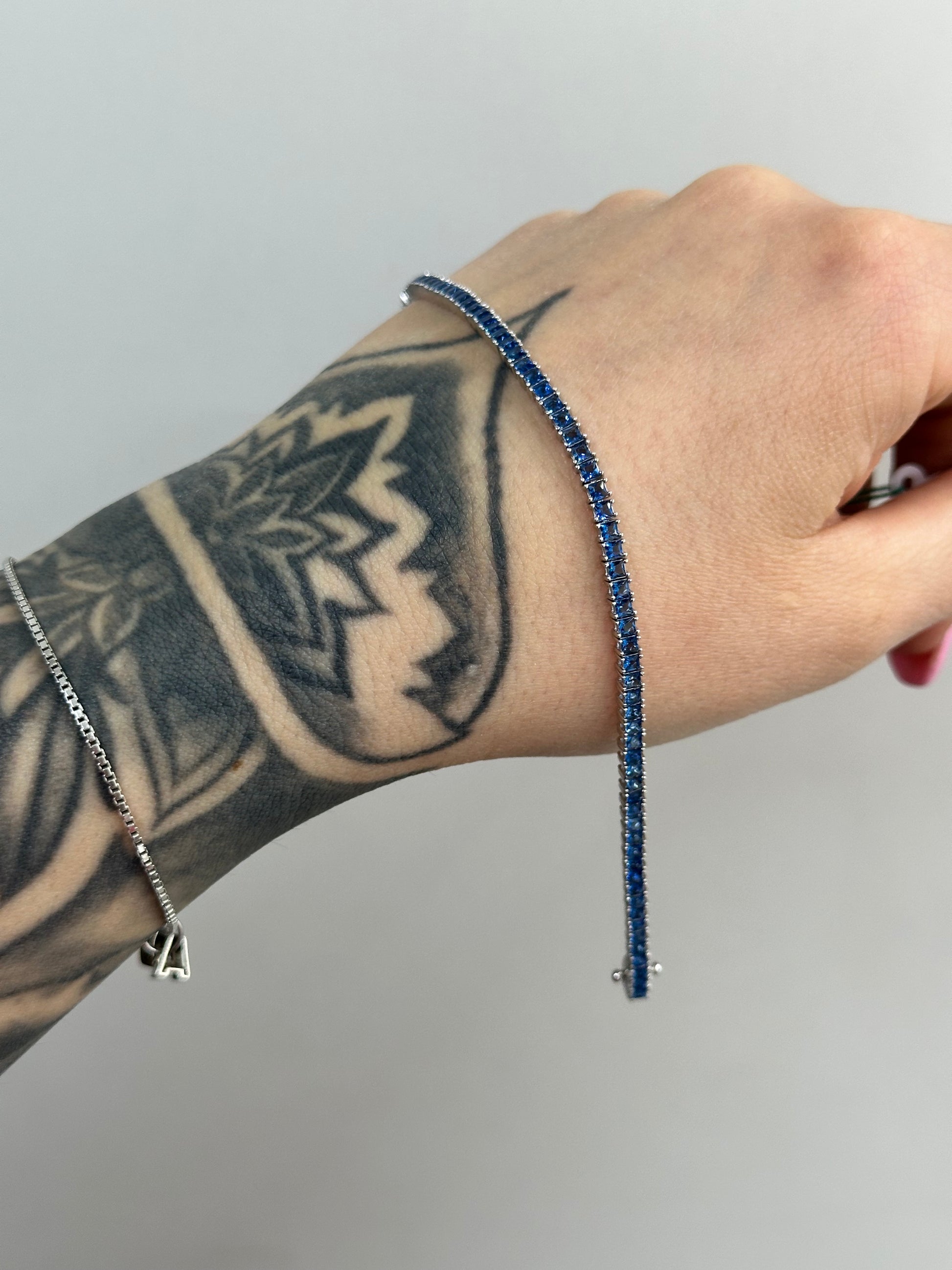 BRACCIALE TENNIS BLUE BAGUETTE ARGENTO