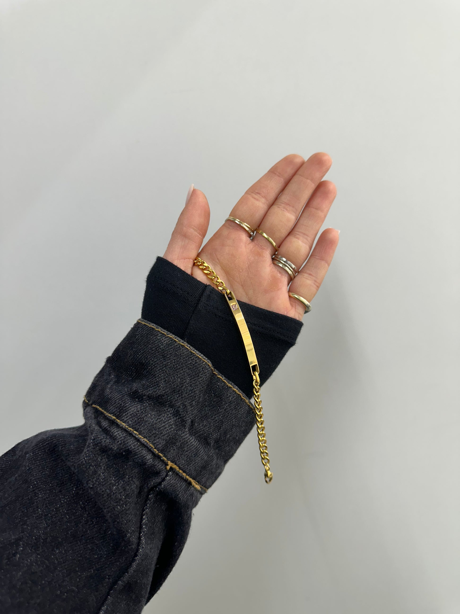 BRACCIALE ACCIAIO CON DORATURA E ZIRCONE  ROSA