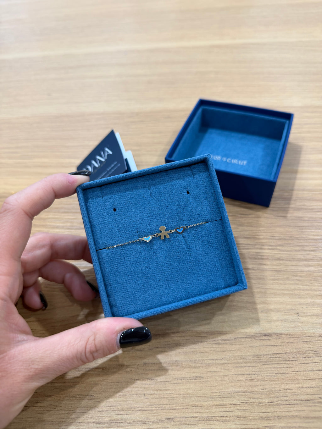 BRACCIALE CON BIMBO E CUORI ORO 9 CARATI DANA