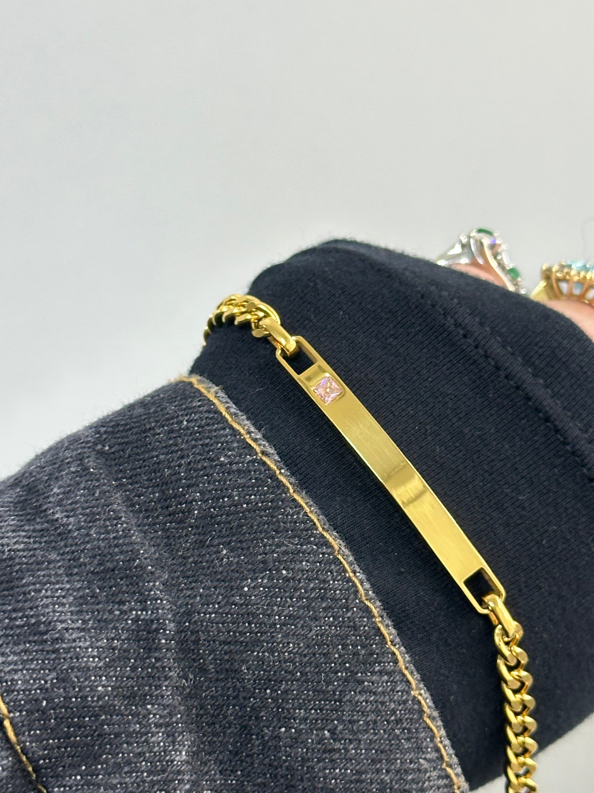 BRACCIALE ACCIAIO CON DORATURA E ZIRCONE  ROSA