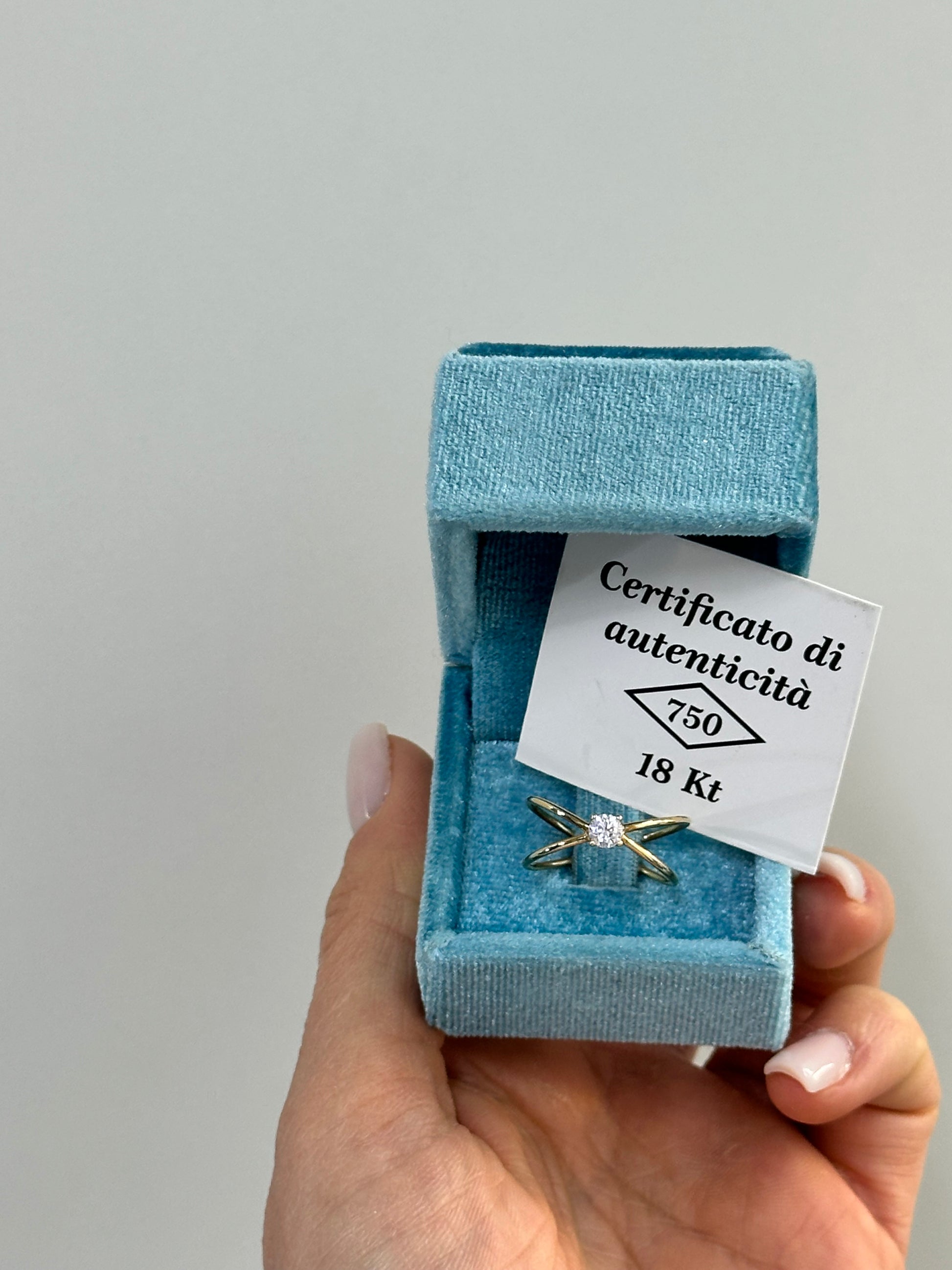 ANELLO INCROCIO CON ZIRCONE ORO 18KT