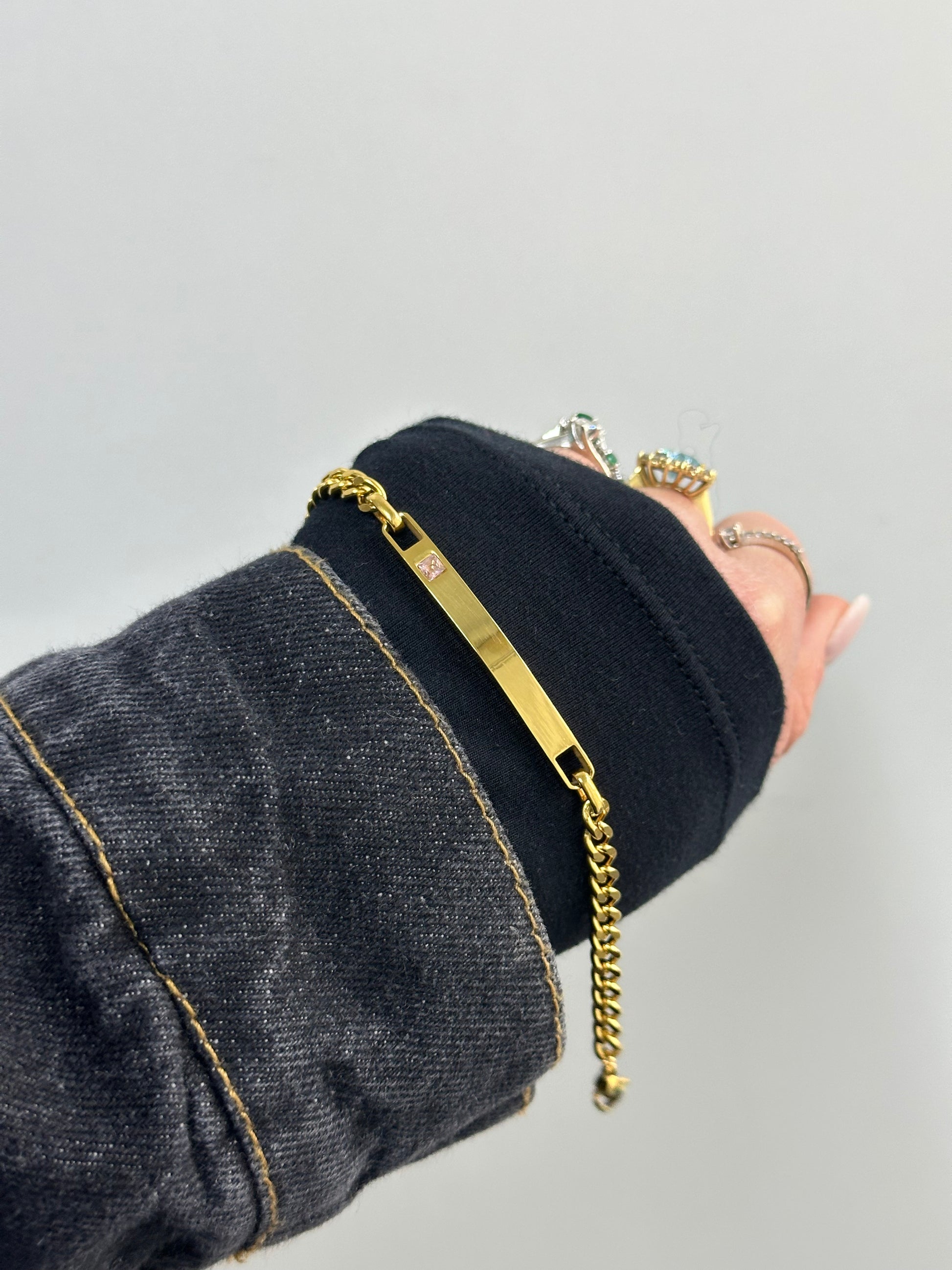 BRACCIALE ACCIAIO CON DORATURA E ZIRCONE  ROSA