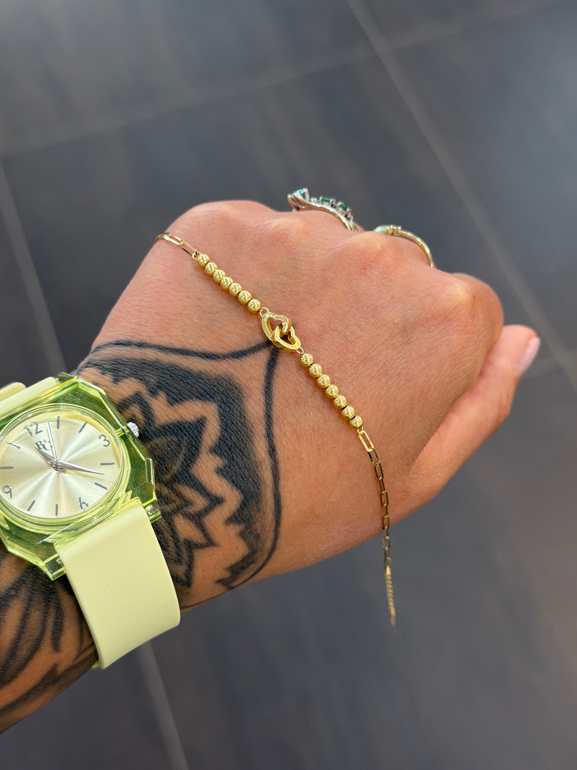 BRACCIALE ORO 18KT CUORI INTRECCIATI
