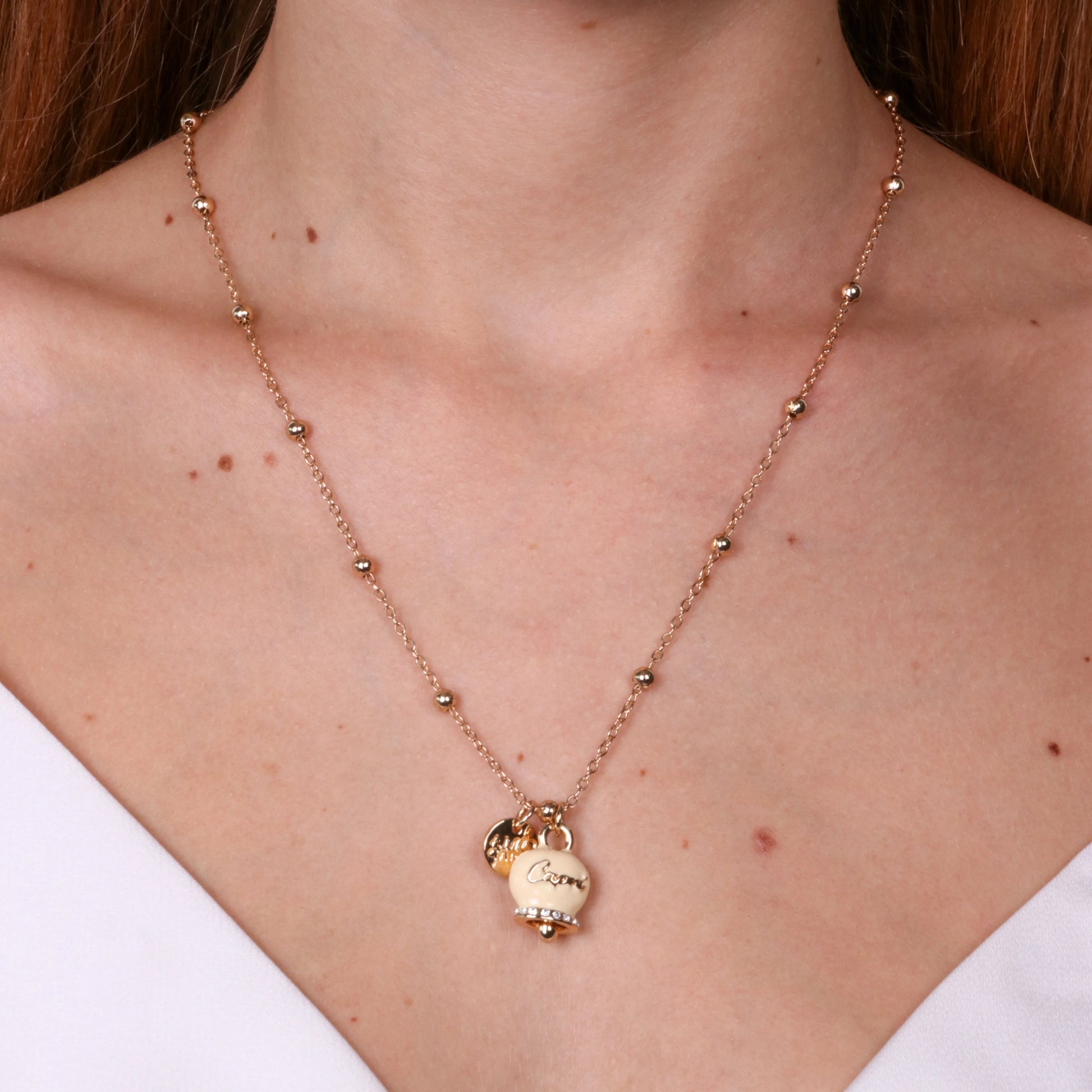 COLLANA IN METALLO CON CAMPANELLA CREMA AMO CAPRI